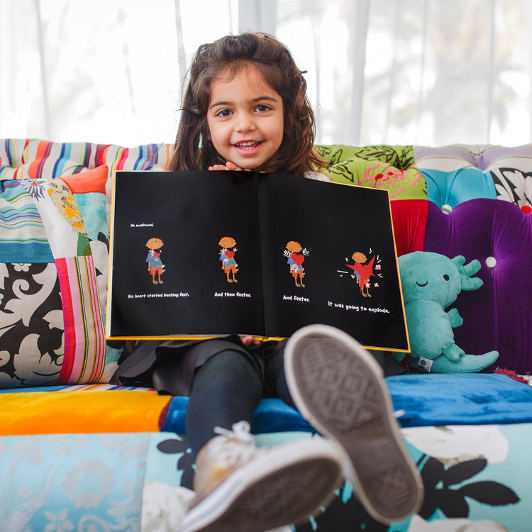 girl showing story book